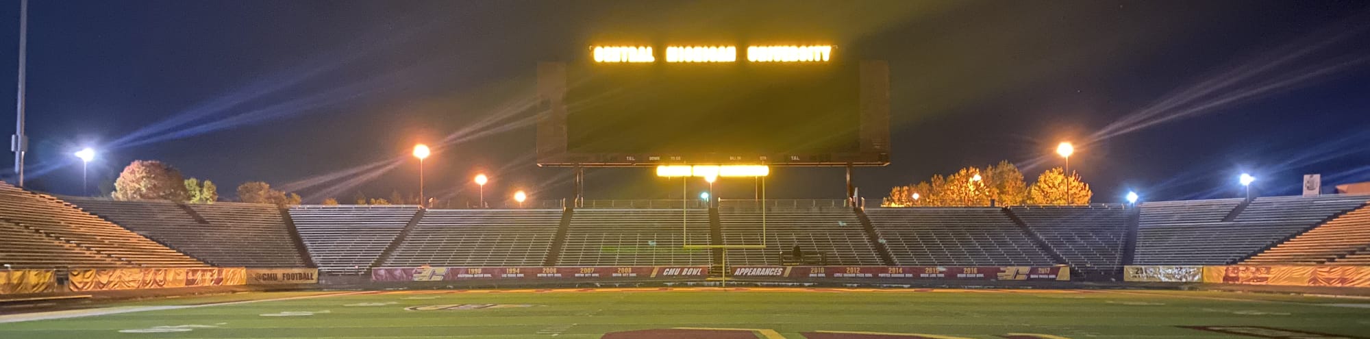 empty football stadium at night under the lights College Station