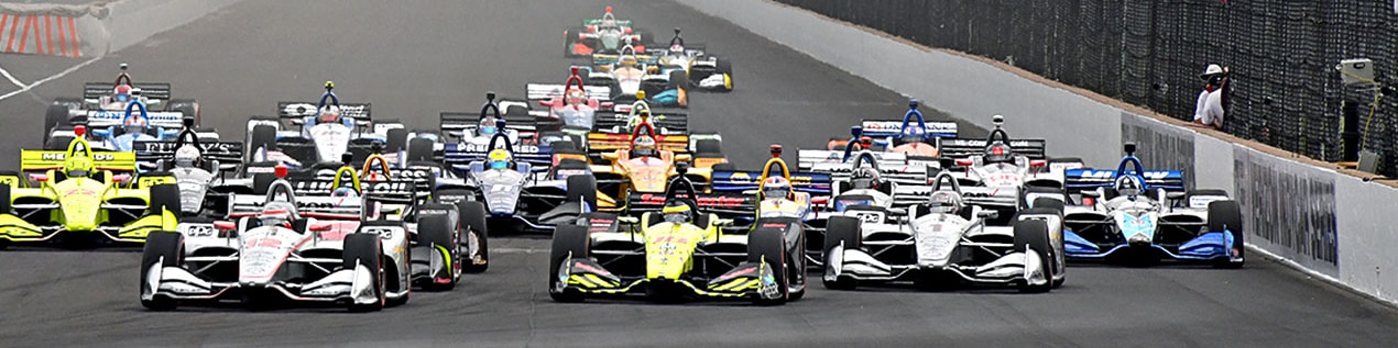 indy cars racing to through the start line College Station